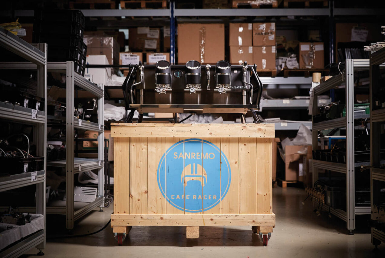 Sanremo Cafe Racer 3 Groups Dolomiti Edition in black in the Sanremo warehouse on a Sanremo pallet box