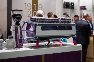 Sanremo Cafe Racer 3 groups Commercial Espresso Machine White Edition, and White Sanremo Coffee Grinder, rear view