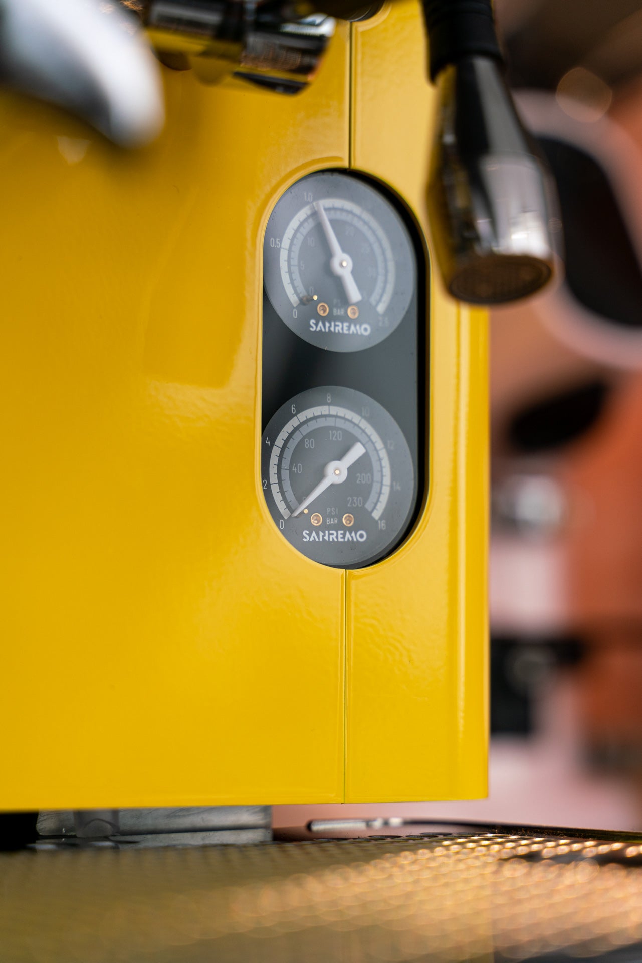 Sanremo CUBE espresso machine for home baristas in yellow, close-up to pump and boiler pressure gauge