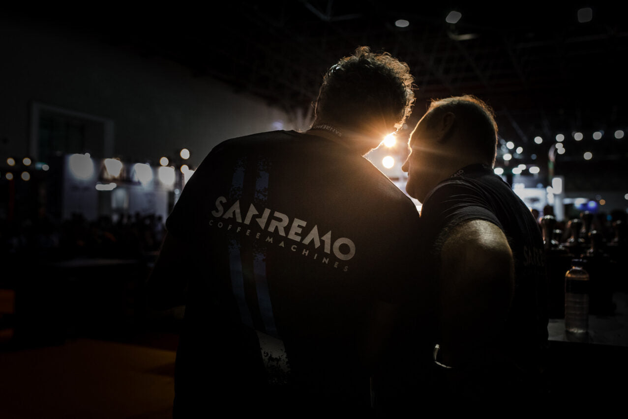 Sanremo team member wearing 'Sanremo Coffee machines' shirt at coffee event