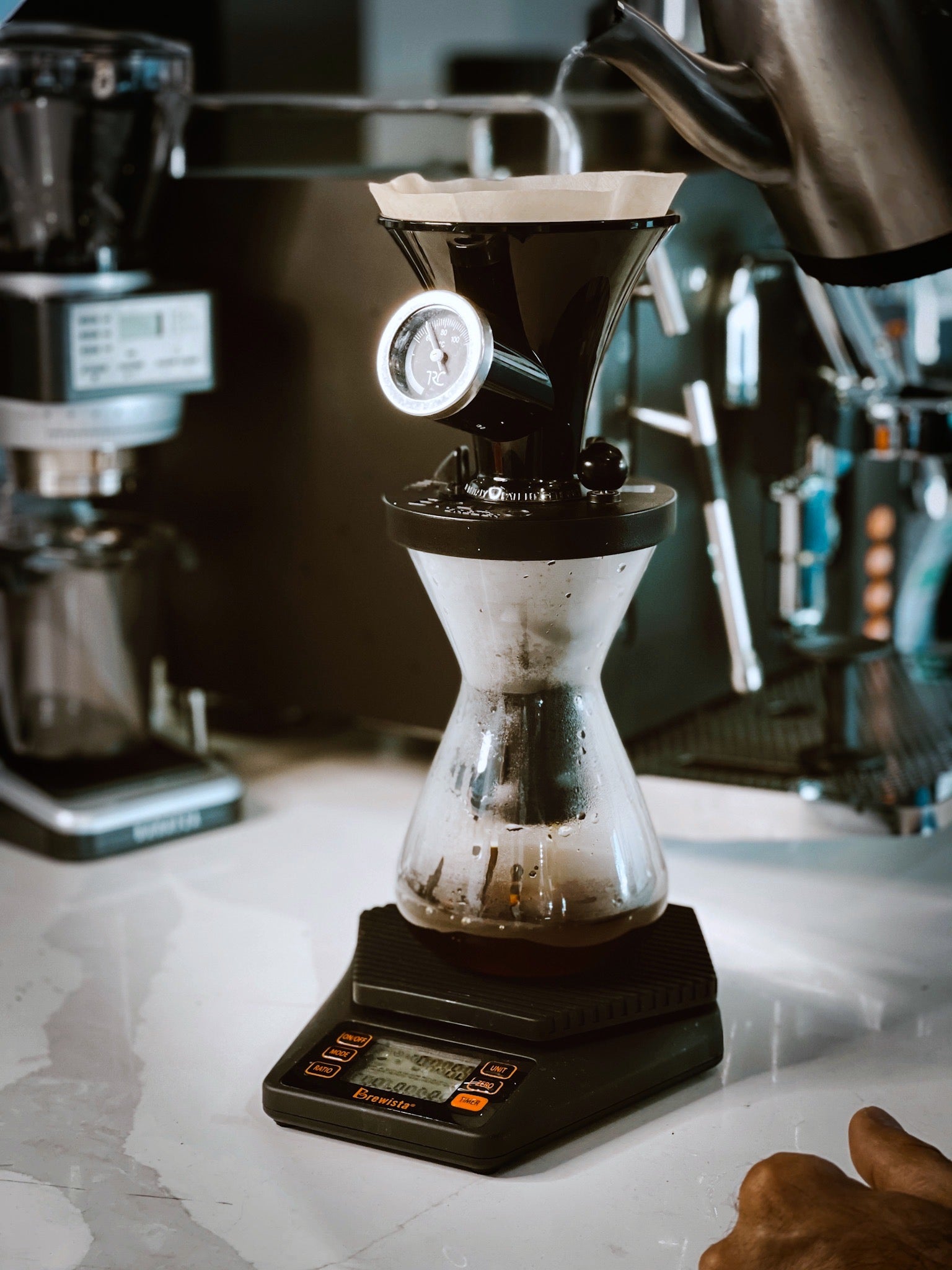 Sanremo Bravo Brewer with barista in action, café setting