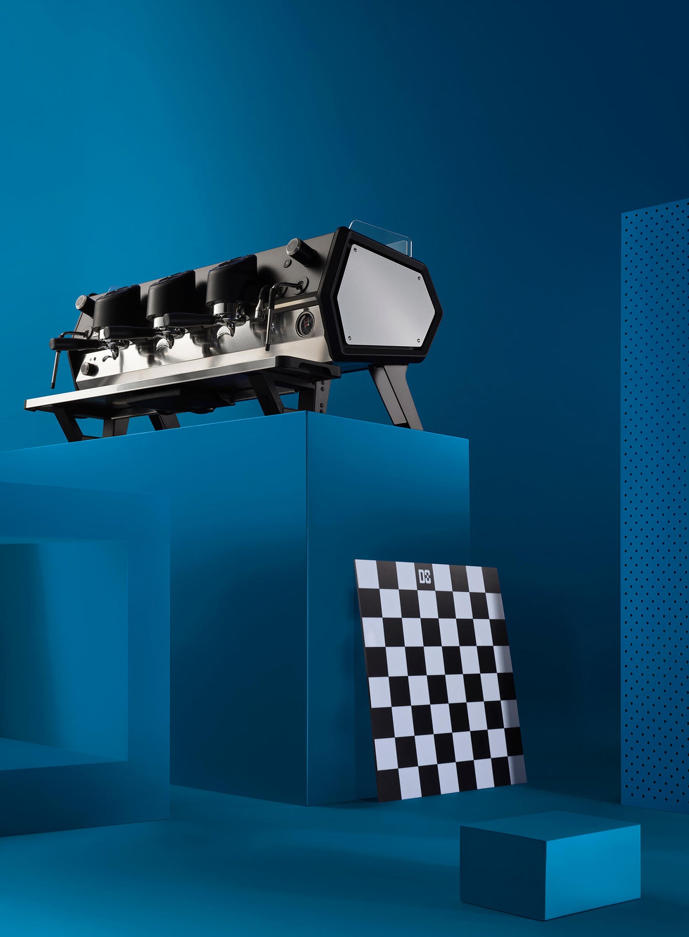 Sanremo D8 3 Group espresso machine in black with chessboard and blue background