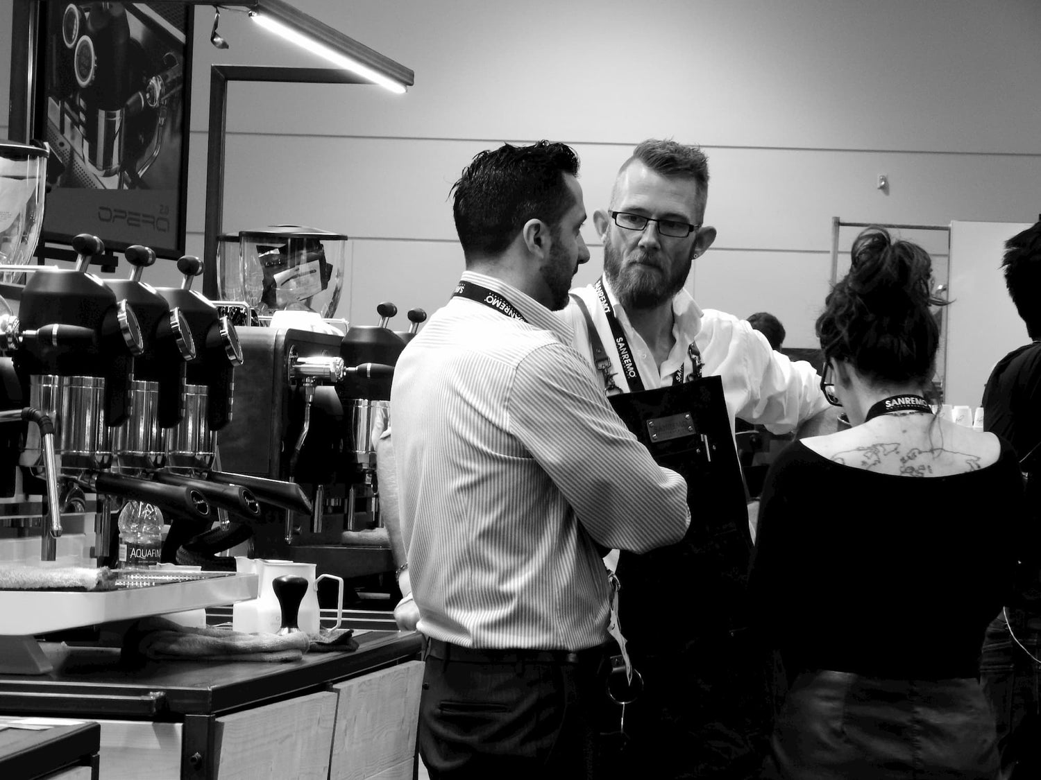 Barista training on Sanremo professional espresso machine at coffee industry event